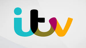 The ITV logo featuring lowercase letters itv in a modern, rounded font with each letter in a different color: teal, black, pink, and yellow, on a light gray background.